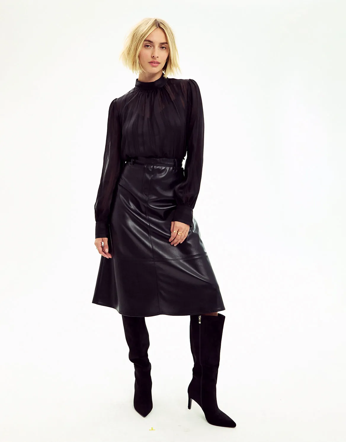 An ELLE Collections black outfit photographed in a studio